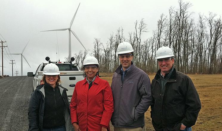 Julia Bovey, First Wind; Tracey LeBeau; Neil Kiely, First Wind; and Bob Springer (NREL) at First Wind's new Rollins project near Lincoln, Maine. Julia Bovey, First Wind; Tracey LeBeau; Neil Kiely, First Wind; and Bob Springer (NREL) at First Wind's new Rollins project near Lincoln, Maine.