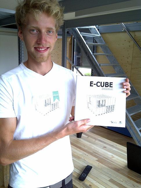 Pieter Jan De Loof, a student at Ghent University, displays the assembly instructions for E-Cube, Team Belgium’s entry to the U.S. Department of Energy Solar Decathlon 2011.