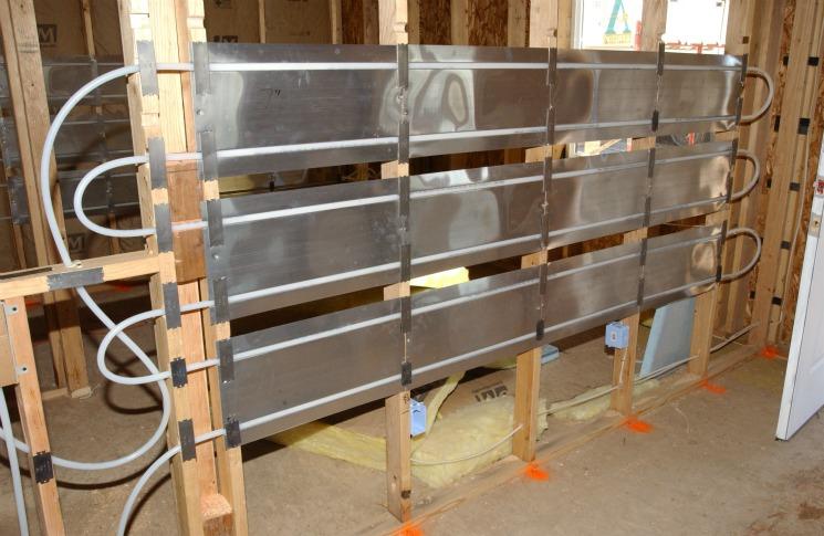 In-wall radiant heating in a house under construction near Denver. | Photo courtesy of Warren Gretz, NREL.