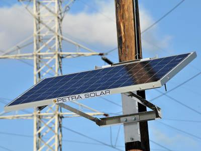 SunWave solar power systems are attached to utility poles, where they can gather sun power as well as provide a point of data gathering for utility companies to monitor the grid. | Photo courtesy Petra Solar