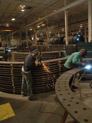 Bassett employees work on embedment (anchor) rings for the wind turbine foundations. Bassett just received a 48C tax credit to invest in capital equipment for wind turbine tower manufacturing.| Photo courtesy Bassett Mechanical Bassett employees work on embedment (anchor) rings for the wind turbine foundations. Bassett just received a 48C tax credit to invest in capital equipment for wind turbine tower manufacturing.| Photo courtesy Bassett Mechanical