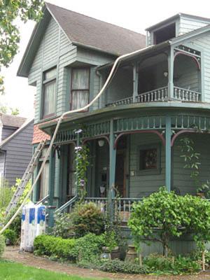 Insulation is blown into the home of Roy and Kim Fox in Portland, Ore. EcoTech modified its equipment to avoid damaging the home, which was built in 1884. | Photo courtesy of Roy Fox |