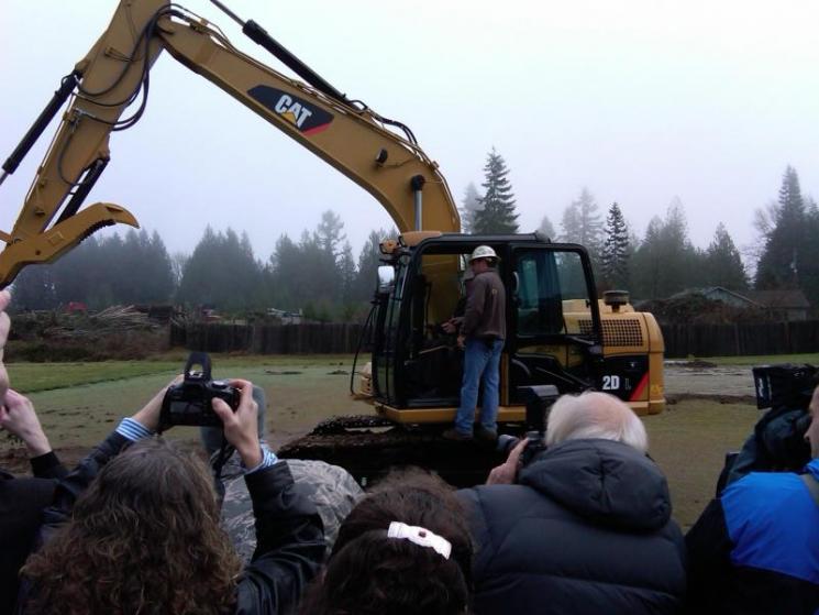 Oregon Governor Kulongoski maneuvers a backhoe to break ground at the Vernonia school site. | Department of Energy Image | Photo by Joel Danforth, Contractor | Public Domain |