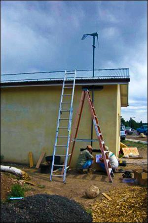 This wind turbine, along with a solar photovoltaic system, will be used to power the school's off-grid greenhouse. | Image courtesy of Wind Powering America This wind turbine, along with a solar photovoltaic system, will be used to power the school's off-grid greenhouse. | Image courtesy of Wind Powering America