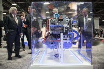 This week, the latest vehicles technologies are on display at the Washington Auto Show in Washington, D.C. In this photo, Secretary Moniz looks at the fuel cell and motor used to power Hyundaiâs Tucson fuel cell vehicle. Fuel cell vehicles use hydrogen to produce electricity, which powers an electric motor to make the vehicle and its accessories work. | Photo by Sarah Gerrity, Energy Department. This week, the latest vehicles technologies are on display at the Washington Auto Show in Washington, D.C. In this photo, Secretary Moniz looks at the fuel cell and motor used to power Hyundaiâs Tucson fuel cell vehicle. Fuel cell vehicles use hydrogen to produce electricity, which powers an electric motor to make the vehicle and its accessories work. | Photo by Sarah Gerrity, Energy Department.