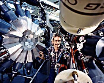 What in the world is happening in this photo?
The person pictured here is an Oak Ridge National Laboratory technician, making adjustments to a particle accelerator, part of the Holifield Heavy Ion Research Facility (HHIRF) in Oak Ridge, Tennessee. This photo was taken in January 1987.
HHIRFâs last experimental run was in 1992, but during its decade of operation, it set the stage for a wide range of scientific research experiments at Oak Ridge National Lab. By accelerating intense beams of light ions to strike a target, the facility creates short-lived, radioactive nuclei that are used for astrophysics research. Fun fact: The nuclei exist for just about one-billionth of a second. | Photo courtesy of Oak Ridge National Laboratory. What in the world is happening in this photo?
The person pictured here is an Oak Ridge National Laboratory technician, making adjustments to a particle accelerator, part of the Holifield Heavy Ion Research Facility (HHIRF) in Oak Ridge, Tennessee. This photo was taken in January 1987.
HHIRFâs last experimental run was in 1992, but during its decade of operation, it set the stage for a wide range of scientific research experiments at Oak Ridge National Lab. By accelerating intense beams of light ions to strike a target, the facility creates short-lived, radioactive nuclei that are used for astrophysics research. Fun fact: The nuclei exist for just about one-billionth of a second. | Photo courtesy of Oak Ridge National Laboratory.