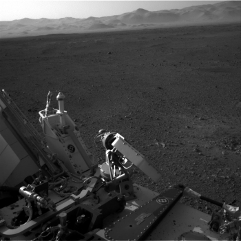 On Monday, August 6, 2012, NASA's Curiosity rover arrived on the surface of Mars to gather geological and environmental data to determine if the planet has ever had the potential to support life. This photo was taken by a navigation camera located toward the back-left of the Curiosity rover, and features part of the rover's nuclear <a href="/node/381709" target="_blank">power supply</a>. Beyond the rover itself, Curiosity's exploration reveals the desert-like terrain of Mars's Gale Crater. | Photo courtesy of NASA/JPL-Caltech. On Monday, August 6, 2012, NASA's Curiosity rover arrived on the surface of Mars to gather geological and environmental data to determine if the planet has ever had the potential to support life. This photo was taken by a navigation camera located toward the back-left of the Curiosity rover, and features part of the rover's nuclear <a href="/node/381709" target="_blank">power supply</a>. Beyond the rover itself, Curiosity's exploration reveals the desert-like terrain of Mars's Gale Crater. | Photo courtesy of NASA/JPL-Caltech.