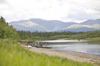 In Alaska's rural villages, many families struggle with the impact of high energy costs -- often times, almost half of a family's income is spent on fuel to power a home. To face this, the Department of Energy's Office of Indian Energy works closely with tribal nations, state government, NGOs and the private sector to help tribes develop the energy resources that exist on tribal lands.
NANA is an organization that operates in northwest Alaska -- the region pictured in the pastoral landscape above. Through building businesses and using smart development of Alaskan resources, NANA's strategic energy plan involves expanding sources of renewable energy, with the goal of reducing the region's dependence on fossil fuels by 50 percent by the year 2025. <a href="/node/625446" target="_blank">Learn more about the Energy Department's efforts to reduce energy costs in Alaska</a>. | Photo courtesy of NANA, Arend. In Alaska's rural villages, many families struggle with the impact of high energy costs -- often times, almost half of a family's income is spent on fuel to power a home. To face this, the Department of Energy's Office of Indian Energy works closely with tribal nations, state government, NGOs and the private sector to help tribes develop the energy resources that exist on tribal lands.
NANA is an organization that operates in northwest Alaska -- the region pictured in the pastoral landscape above. Through building businesses and using smart development of Alaskan resources, NANA's strategic energy plan involves expanding sources of renewable energy, with the goal of reducing the region's dependence on fossil fuels by 50 percent by the year 2025. <a href="/node/625446" target="_blank">Learn more about the Energy Department's efforts to reduce energy costs in Alaska</a>. | Photo courtesy of NANA, Arend.