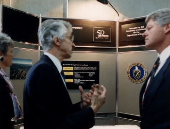 Since 1977, the people of the U.S. Department of Energy have been delivering the science, innovation and expertise required to advance America's energy, economic and national security. In this photo taken in 1993, Director of Los Alamos National Laboratory (LANL) Dr. Siegfried Hecker gives President Bill Clinton and Secretary of Energy Hazel O'Leary a tour of the Lab. That year, LANL marked its 50th anniversary. | Photo courtesy of the Department of Energy. Since 1977, the people of the U.S. Department of Energy have been delivering the science, innovation and expertise required to advance America's energy, economic and national security. In this photo taken in 1993, Director of Los Alamos National Laboratory (LANL) Dr. Siegfried Hecker gives President Bill Clinton and Secretary of Energy Hazel O'Leary a tour of the Lab. That year, LANL marked its 50th anniversary. | Photo courtesy of the Department of Energy.