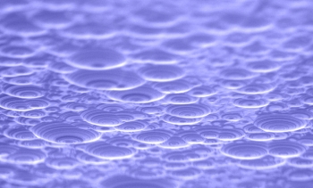 Have you ever heard of Laue lenses? These multilayer lenses are used to focus high-intensity x-ray beams to show the details of nano material structures. In this photo, the drop-like domes were carved through a process called reactive ion etching, which produced the striped bubbles you see in the Laue lens. The prototype in this image helped scientists perfect the process of creating lenses so precise that scientists are able to focus x-rays to within a single nanometer. | Photo courtesy of Brookhaven National Laboratory. Have you ever heard of Laue lenses? These multilayer lenses are used to focus high-intensity x-ray beams to show the details of nano material structures. In this photo, the drop-like domes were carved through a process called reactive ion etching, which produced the striped bubbles you see in the Laue lens. The prototype in this image helped scientists perfect the process of creating lenses so precise that scientists are able to focus x-rays to within a single nanometer. | Photo courtesy of Brookhaven National Laboratory.