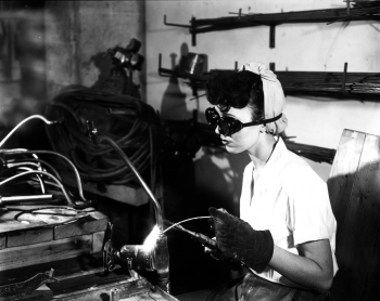 James Edward Westcott was one of the only people permitted to have a camera at the Oak Ridge site during the Manhattan Project and the Cold War. He documented the lives of many of the residents and workers in the âAtomic City,â in the days before Oak Ridge National Laboratory was actually Oak Ridge National Lab.
In this February 1945 photo, a young woman is welding in the prefabrication shop building, part of the K-25 uranium separation facilities, one of three Manhattan Project sites in Oak Ridge, Tennessee. Many of the men and women who worked on these projects still live in Oak Ridge, Tennessee, today. | Photo by James Edward Westcott, courtesy of DOE & the National Archives. James Edward Westcott was one of the only people permitted to have a camera at the Oak Ridge site during the Manhattan Project and the Cold War. He documented the lives of many of the residents and workers in the âAtomic City,â in the days before Oak Ridge National Laboratory was actually Oak Ridge National Lab.
In this February 1945 photo, a young woman is welding in the prefabrication shop building, part of the K-25 uranium separation facilities, one of three Manhattan Project sites in Oak Ridge, Tennessee. Many of the men and women who worked on these projects still live in Oak Ridge, Tennessee, today. | Photo by James Edward Westcott, courtesy of DOE & the National Archives.
