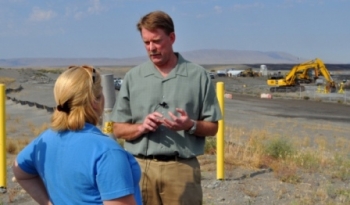 Hanford Federal Project Director Mark French explains the waste site remediation efforts taking place at the 618-10 Burial Ground to a member of the media. Hanford Federal Project Director Mark French explains the waste site remediation efforts taking place at the 618-10 Burial Ground to a member of the media.