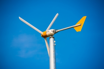 At Argonne National Laboratory, the power generated by this 10 kW wind turbine helps scientists and engineers study the interaction of wind energy, electric vehicle charging and grid technology. The turbine is also estimated to offset more than 10 metric tons of greenhouse gas emissions annually. Learn more about <a href="http://www.anl.gov/energy/renewable-energy" target="_blank">renewable energy research at Argonne</a>. | Photo courtesy of Argonne National Laboratory. At Argonne National Laboratory, the power generated by this 10 kW wind turbine helps scientists and engineers study the interaction of wind energy, electric vehicle charging and grid technology. The turbine is also estimated to offset more than 10 metric tons of greenhouse gas emissions annually. Learn more about <a href="http://www.anl.gov/energy/renewable-energy" target="_blank">renewable energy research at Argonne</a>. | Photo courtesy of Argonne National Laboratory.