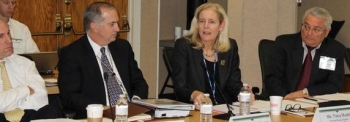 EM Principal Deputy Assistant Secretary Tracy Mustin, second from right, speaks with members of the Environmental Management Advisory Board this week as EM Deputy Assistant Secretary, Safety, Security and Quality Programs, Matthew Moury, second from left, listens. EM Principal Deputy Assistant Secretary Tracy Mustin, second from right, speaks with members of the Environmental Management Advisory Board this week as EM Deputy Assistant Secretary, Safety, Security and Quality Programs, Matthew Moury, second from left, listens.