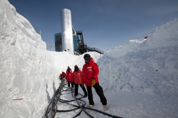 Researchers drilled holes in the ice to a depth of almost 1.5 miles, and lowered 60 basketball-sized detectors called digital optical modules (DOMs) into each of the 86 holes. They then had to pull cables to connect the sensors to IceCube Labâs servers in order to collect data. | Photo courtesy of the National Science Foundation Researchers drilled holes in the ice to a depth of almost 1.5 miles, and lowered 60 basketball-sized detectors called digital optical modules (DOMs) into each of the 86 holes. They then had to pull cables to connect the sensors to IceCube Labâs servers in order to collect data. | Photo courtesy of the National Science Foundation
