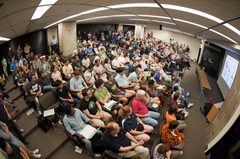 More than 200 Fermilab researchers and staffers crowded into an auditorium at 2 a.m. EDT July 4 and waited for the latest announcement regarding the Higgs boson.
When CERN Director-General Rolf-Dieter Heuer said the words - "I think we have it" â the Fermilab crowd erupted into applause.
Fermi National Accelerator Laboratory and Brookhaven National Laboratory are the host laboratories for the U.S. contingents of the Large Hadron Collider (LHC) experiments that found the Higgs boson-like particle. They and researchers from Argonne National Laboratory, Lawrence Berkeley National Laboratory and SLAC National Accelerator Laboratory are among the 1,700 scientists, engineers, technicians and graduate students from the United States that helped design, build and operate the LHC accelerator and particle detectors, and analyze the data from the collisions. Read the story: <a href="http://energy.gov/articles/last-piece-puzzle-celebrating-higgs-boson">The Last Piece of the Puzzle: Celebrating the Higgs Boson</a> | Photo courtesy of Fermilab More than 200 Fermilab researchers and staffers crowded into an auditorium at 2 a.m. EDT July 4 and waited for the latest announcement regarding the Higgs boson.
When CERN Director-General Rolf-Dieter Heuer said the words - "I think we have it" â the Fermilab crowd erupted into applause.
Fermi National Accelerator Laboratory and Brookhaven National Laboratory are the host laboratories for the U.S. contingents of the Large Hadron Collider (LHC) experiments that found the Higgs boson-like particle. They and researchers from Argonne National Laboratory, Lawrence Berkeley National Laboratory and SLAC National Accelerator Laboratory are among the 1,700 scientists, engineers, technicians and graduate students from the United States that helped design, build and operate the LHC accelerator and particle detectors, and analyze the data from the collisions. Read the story: <a href="http://energy.gov/articles/last-piece-puzzle-celebrating-higgs-boson">The Last Piece of the Puzzle: Celebrating the Higgs Boson</a> | Photo courtesy of Fermilab
