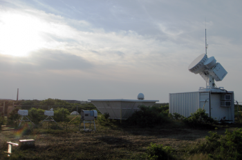 This observatory is part of an air particles research initiative at Cape Cod National Seashore in Massachusetts, and includes dozens of sophisticated instruments that take continuous ground-based measurements of clouds, aerosols, and other atmospheric properties. | Photo courtesy of the ARM Climate Research Facility. This observatory is part of an air particles research initiative at Cape Cod National Seashore in Massachusetts, and includes dozens of sophisticated instruments that take continuous ground-based measurements of clouds, aerosols, and other atmospheric properties. | Photo courtesy of the ARM Climate Research Facility.