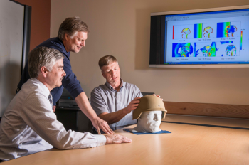 Paul Taylor, right, and John Ludwigsen, center, both researchers with Sandiaâs Terminal Ballistics Technology Department, and Corey Ford, a neurologist at the University of New Mexico's Health Sciences Center, discuss their research on traumatic brain injuries. | Photo by Randy Montoya Paul Taylor, right, and John Ludwigsen, center, both researchers with Sandiaâs Terminal Ballistics Technology Department, and Corey Ford, a neurologist at the University of New Mexico's Health Sciences Center, discuss their research on traumatic brain injuries. | Photo by Randy Montoya