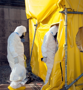 Workers remove an old door during H Canyon facility modifications. Workers remove an old door during H Canyon facility modifications.