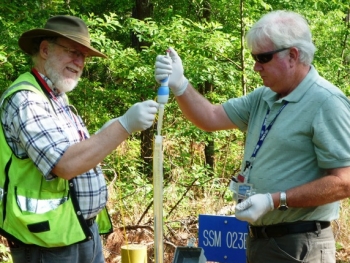 Savannah River National Laboratory Engineering Specialist Keith Hyde, right, and Savannah River Nuclear Solutions Geologist Bob Craig use a disposable Hydrasleeve sampler to monitor groundwater as part of efforts to meet regulatory requirements at the Savannah River Site. Savannah River National Laboratory Engineering Specialist Keith Hyde, right, and Savannah River Nuclear Solutions Geologist Bob Craig use a disposable Hydrasleeve sampler to monitor groundwater as part of efforts to meet regulatory requirements at the Savannah River Site.