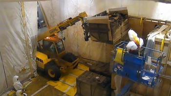 The box retrieval forklift carriage is used to lift a degraded box as retrieval personnel monitor progress. The box retrieval forklift carriage is used to lift a degraded box as retrieval personnel monitor progress.