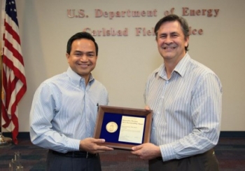 Department of Energy Carlsbad Field Office Site Operations Director Casey Gadbury (right) presents Farok Sharif, President and Project Manager for Nuclear Waste Partnership LLC, the management and operating contractor at the Waste Isolation Pilot Plant, with a 2012 DOE Sustainability Award during a recognition event at WIPP. More than 20 CBFO and contractor employees were recognized with sustainability awards in four categories. Department of Energy Carlsbad Field Office Site Operations Director Casey Gadbury (right) presents Farok Sharif, President and Project Manager for Nuclear Waste Partnership LLC, the management and operating contractor at the Waste Isolation Pilot Plant, with a 2012 DOE Sustainability Award during a recognition event at WIPP. More than 20 CBFO and contractor employees were recognized with sustainability awards in four categories.