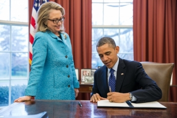 Secretary of State Hillary Rodham Clinton watches as President Barack Obama signs a Presidential memorandum, "Coordination of Policies and Programs to Promote Gender Equality and Empower Women and Girls Globally," in the Oval Office, Jan. 20, 2013. (Official White House Photo by Pete Souza) Secretary of State Hillary Rodham Clinton watches as President Barack Obama signs a Presidential memorandum, "Coordination of Policies and Programs to Promote Gender Equality and Empower Women and Girls Globally," in the Oval Office, Jan. 20, 2013. (Official White House Photo by Pete Souza)