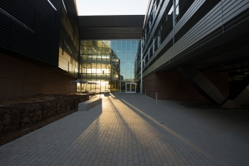The sun rises on the Energy Systems Integration Facility (ESIF) at the National Renewable Energy Laboratory (NREL) in Golden, Colorado. Research at ESIF will help overcome challenges related to the interconnection of distributed energy systems and the integration of renewable energy technologies into the electricity grid. | Photo by Dennis Schroeder, National Renewable Energy Lab. The sun rises on the Energy Systems Integration Facility (ESIF) at the National Renewable Energy Laboratory (NREL) in Golden, Colorado. Research at ESIF will help overcome challenges related to the interconnection of distributed energy systems and the integration of renewable energy technologies into the electricity grid. | Photo by Dennis Schroeder, National Renewable Energy Lab.
