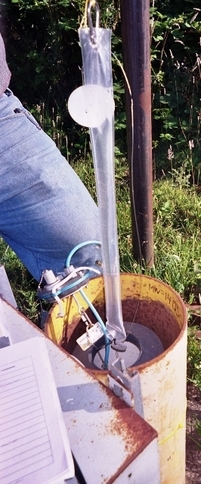 A passive sampler is placed in a groundwater monitoring well. A passive sampler is placed in a groundwater monitoring well.