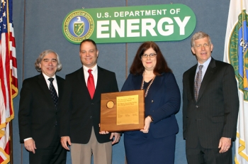Members of the Salt Waste Processing Facility 2013 Renegotiation Team receive the Secretary's Achievement Award from Secretary Moniz, far left, and Deputy Secretary Poneman, far right. Team members pictured are Dean Hammonds and Melissa Rider. Members of the Salt Waste Processing Facility 2013 Renegotiation Team receive the Secretary's Achievement Award from Secretary Moniz, far left, and Deputy Secretary Poneman, far right. Team members pictured are Dean Hammonds and Melissa Rider.