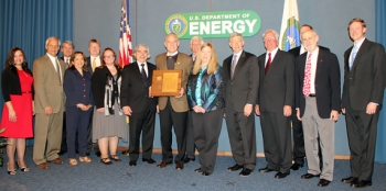 Salt Waste Disposal Technologies Team members receive the Secretary's Achievement Award from Secretary Moniz, seventh from left, and Deputy Secretary Poneman, fifth from right. Team members pictured, left to right, are Celia Aponte, Brent Gifford, William Brasel, Dr. Monica Regalbuto, Clifford Conner, Sarah Rocha, Dr. Bruce Moyer, Roy Schepens, Patricia Suggs, Dr. Leon Klatt, Dr. Thomas Burns, Professor Vincent Van Brunt, and Seth Campbell. Salt Waste Disposal Technologies Team members receive the Secretary's Achievement Award from Secretary Moniz, seventh from left, and Deputy Secretary Poneman, fifth from right. Team members pictured, left to right, are Celia Aponte, Brent Gifford, William Brasel, Dr. Monica Regalbuto, Clifford Conner, Sarah Rocha, Dr. Bruce Moyer, Roy Schepens, Patricia Suggs, Dr. Leon Klatt, Dr. Thomas Burns, Professor Vincent Van Brunt, and Seth Campbell.