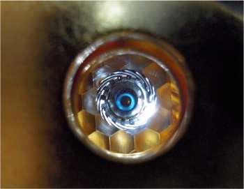 The photo above is of a cryogenically cooled target in the National Ignition Facility as "seen" by the laser through the hohlraum's laser entrance hole. | Photo courtesy of Lawrence Livermore National Laboratory. The photo above is of a cryogenically cooled target in the National Ignition Facility as "seen" by the laser through the hohlraum's laser entrance hole. | Photo courtesy of Lawrence Livermore National Laboratory.