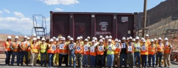 Moab site workers stand in front of the container holding the 6 millionth ton. Moab site workers stand in front of the container holding the 6 millionth ton.