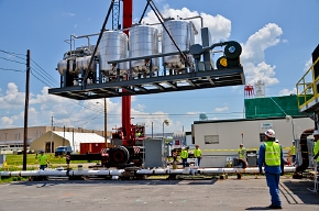 A crane lowers the carbon treatment system into place during construction. A crane lowers the carbon treatment system into place during construction.