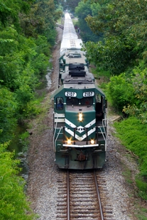 A P&L locomotive travels near Woodville Road, south of the Paducah site, with the waste shipment in tow. A P&L locomotive travels near Woodville Road, south of the Paducah site, with the waste shipment in tow.