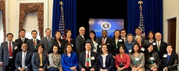 Members of the 2013 AAGEN SES Development Program class gather for a photo at the programâs kickoff at the White House in March 2012. EMâs John Moon and Dr. Ming Zhu are in the second row; Moon is second from left and Zhu is third from left. Melvin G. Williams, Jr., former Associate Deputy Energy Secretary, is seated far left in the first row. Members of the 2013 AAGEN SES Development Program class gather for a photo at the programâs kickoff at the White House in March 2012. EMâs John Moon and Dr. Ming Zhu are in the second row; Moon is second from left and Zhu is third from left. Melvin G. Williams, Jr., former Associate Deputy Energy Secretary, is seated far left in the first row.