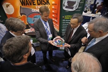 Steven Chu, Secretary of the United States Department of Energy, holds a model of the wave disk engine at the 2011 ARPA-E Summit's Technology Showcase. | Photo by Ken Shipp. Steven Chu, Secretary of the United States Department of Energy, holds a model of the wave disk engine at the 2011 ARPA-E Summit's Technology Showcase. | Photo by Ken Shipp.
