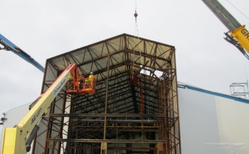 Workers construct an enclosure for Building H2 at the Separations Process Research Unit Workers construct an enclosure for Building H2 at the Separations Process Research Unit