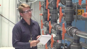 Dean Neshem, a pump-and-treat operations and maintenance engineer, observes operations at one of the Hanford site's five groundwater treatment facilities. Based on
technical recommendations from DOE, CH2M HILL engineers tested and compared multiple resins to determine the products capable of removing contaminants from the groundwater. Dean Neshem, a pump-and-treat operations and maintenance engineer, observes operations at one of the Hanford site's five groundwater treatment facilities. Based on
technical recommendations from DOE, CH2M HILL engineers tested and compared multiple resins to determine the products capable of removing contaminants from the groundwater.