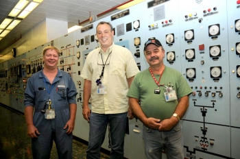 X-326 Facility Manager Jack Tully, left to right, DOE Site Lead Joel Bradburne and Operator Russ Nickell stand in the local control room after the last processing equipment that had been operating in the uranium enrichment cascade at the Portsmouth site in Piketon was shut down. X-326 Facility Manager Jack Tully, left to right, DOE Site Lead Joel Bradburne and Operator Russ Nickell stand in the local control room after the last processing equipment that had been operating in the uranium enrichment cascade at the Portsmouth site in Piketon was shut down.
