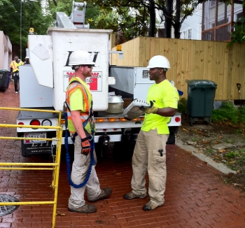 Workers install the final LED streetlight for DC's EECBG-funded energy efficient lighting upgrade. | Energy Department photo, credit Chris Galm. Workers install the final LED streetlight for DC's EECBG-funded energy efficient lighting upgrade. | Energy Department photo, credit Chris Galm.