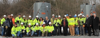 Members of the EM and URS SPRU Project Team gather to celebrate the last shipment of solidified sludge liners today. Members of the EM and URS SPRU Project Team gather to celebrate the last shipment of solidified sludge liners today.