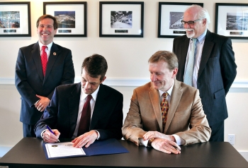 (L to R) U.S. Congressman Chuck Fleischmann, EMâs Principal Deputy Assistant Secretary Mark Whitney, CROET CEO Larence Young, and David Klaus, DOEâs Deputy Undersecretary for Management and Performance, participate in a signing event that transfers 25 acres for private development at ETTP. (L to R) U.S. Congressman Chuck Fleischmann, EMâs Principal Deputy Assistant Secretary Mark Whitney, CROET CEO Larence Young, and David Klaus, DOEâs Deputy Undersecretary for Management and Performance, participate in a signing event that transfers 25 acres for private development at ETTP.