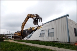 A building is demolished at the Weldon Spring, Missouri, Site. A building is demolished at the Weldon Spring, Missouri, Site.