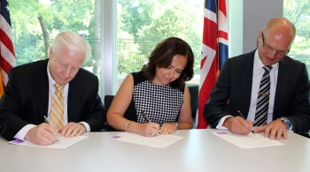 From left to right, DOE Office of Nuclear Energy Deputy Assistant Secretary for Fuel Cycle Technologies John Herczeg, EM Associate Principal Deputy Assistant Secretary Monica Regalbuto, and UK National Nuclear Laboratory Managing Director Paul Howarth sign a Statement of Intent amendment at the British Embassy in Washington, D.C. From left to right, DOE Office of Nuclear Energy Deputy Assistant Secretary for Fuel Cycle Technologies John Herczeg, EM Associate Principal Deputy Assistant Secretary Monica Regalbuto, and UK National Nuclear Laboratory Managing Director Paul Howarth sign a Statement of Intent amendment at the British Embassy in Washington, D.C.