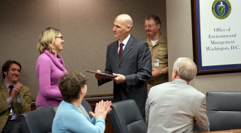 Thomas DâAgostino, right, who retired this month as Under Secretary for Nuclear Security and NNSA Administrator, presents EMâs Candice Trummell with the NNSA Gold Medal earlier this month. Thomas DâAgostino, right, who retired this month as Under Secretary for Nuclear Security and NNSA Administrator, presents EMâs Candice Trummell with the NNSA Gold Medal earlier this month.