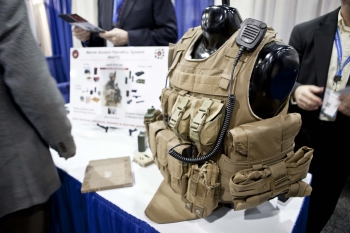 At the 2013 ARPA-E Energy Innovation Summit Technology Showcase, the U.S. Marine Corps table featured a special vest with built-in solar cells, while the U.S. Army table highlighted a vest with a built-in fuel cell battery -- two ways to help efficiently power technology for American soldiers. | Photo by <a href="/node/379579">Sarah Gerrity</a>, Energy Department. At the 2013 ARPA-E Energy Innovation Summit Technology Showcase, the U.S. Marine Corps table featured a special vest with built-in solar cells, while the U.S. Army table highlighted a vest with a built-in fuel cell battery -- two ways to help efficiently power technology for American soldiers. | Photo by <a href="/node/379579">Sarah Gerrity</a>, Energy Department.
