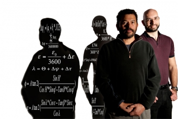 Metrologist Ibrahim Reda (left) and software developer Afshin Andreas developed the Solar Position Algorithm now used by solar trackers, orchard growers, and movie-camera makers. The algorithm used in the SPA appears in the shadow. | Photo by Dennis Schroeder/NREL. Metrologist Ibrahim Reda (left) and software developer Afshin Andreas developed the Solar Position Algorithm now used by solar trackers, orchard growers, and movie-camera makers. The algorithm used in the SPA appears in the shadow. | Photo by Dennis Schroeder/NREL.