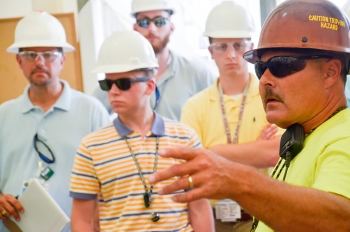 LATA Kentucky groundwater cleanup site superintendent Donnie Bell, far right, describes the project to (from left) Steve Christmas of LATA Kentucky and interns Weston Loyd, Matthew Jehnke, and Wesley Morgan. LATA Kentucky groundwater cleanup site superintendent Donnie Bell, far right, describes the project to (from left) Steve Christmas of LATA Kentucky and interns Weston Loyd, Matthew Jehnke, and Wesley Morgan.