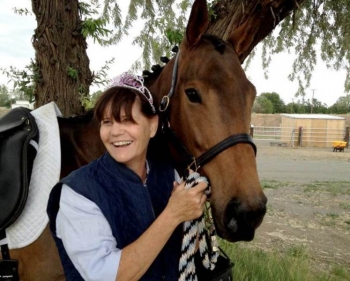 Shortly after arriving at Pacific Northwest National Laboratory, Dr. Kathy Hibbard purchased a young thoroughbred mare. Here, she is pictured at a birthday party thrown by her stable buddies. Shortly after arriving at Pacific Northwest National Laboratory, Dr. Kathy Hibbard purchased a young thoroughbred mare. Here, she is pictured at a birthday party thrown by her stable buddies.